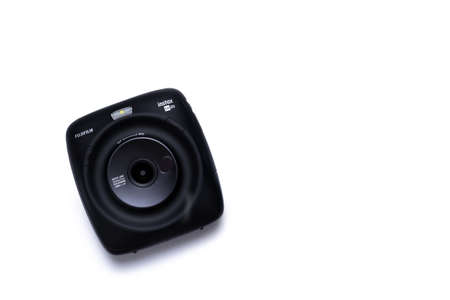 Kyiv, Ukraine - 9 July 2020: Fujifilm Instax Sq 20 Black on a white background with empty place for text.のeditorial素材