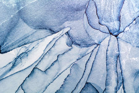 Luxury fluid art painting background. Spilled blue and silver acrylic paint. Alcohol ink splash.