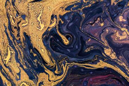 Luxury fluid art painting background. Spilled purple, blue and gold acrylic paint. liquid marble...