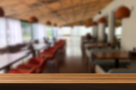 Cafe bar blurred background. wooden table on cafeの写真素材