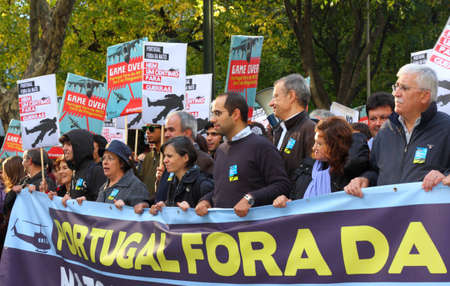 LISBON - NOVEMBER 20: Members of the Portuguese Parliamentary Group of the Left Bloc participate in the protests against NATO, on the last day of NATO Summit, November 20, 2010.のeditorial素材