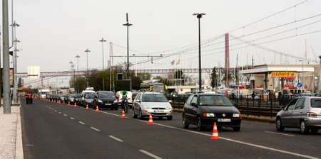 LISBON, PORTUGAL - MARCH 24: Cars line up as a result of traffic restrictions put in place for WRC Rally of Portugal, on March 24 2011, at India avenue in Lisbon, Portugal.のeditorial素材