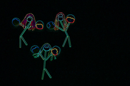 Cheerleader stick figure girls in neon lightsの写真素材