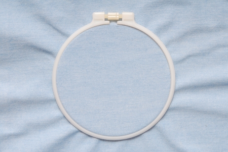 A plastic tambour is on blue denim  の写真素材