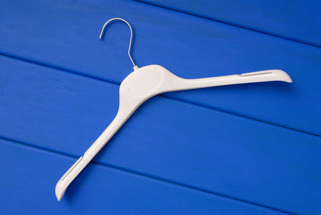 white plastic hanger in on blueの写真素材