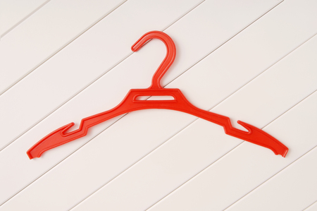 red coat-hanger is on whiteの写真素材