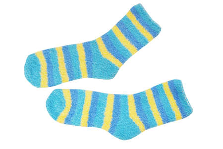 terrycloth striped socks, light blue and yellow stockings are on white background, isolated multicolored terry socks, warm varicolored sockの写真素材