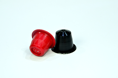 Collection of espresso coffee capsules red isolated on white background, Closeup view with details.の写真素材