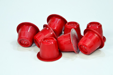 Collection of espresso coffee capsules red isolated on white background, Closeup view with details.の写真素材