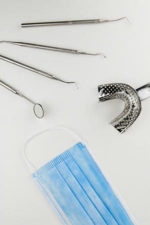 Sets of dental instruments and tools on nutral background