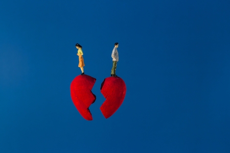 Conceptual of broken heart on the blue background.