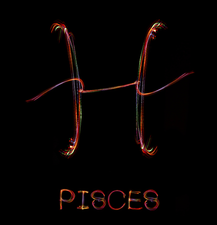 Zodiac sign from led light on black background.の写真素材