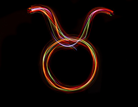 Zodiac sign from led light on black background.の写真素材