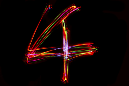 Blurred word writing from light on the black background.の写真素材