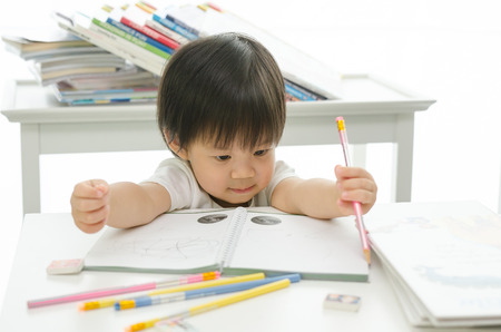 Little asian boy is writingの写真素材