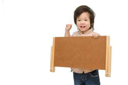 Cute baby with a woodboardの写真素材
