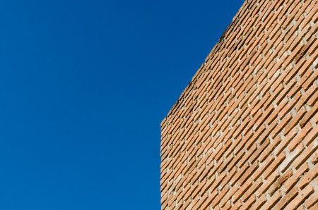 Brick wall and blue sky for backgroundの写真素材