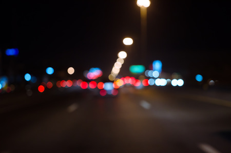 Blurred Defocused Lights of Traffic on a City Road at Night