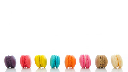 Colorful macaroons isolated on white background with copy spaceの写真素材
