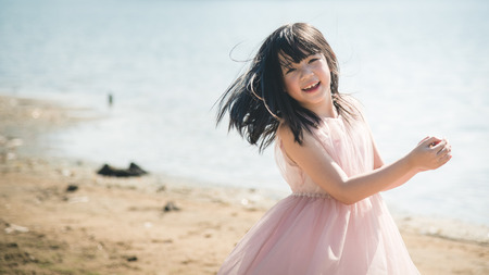 Beautiful asian girl smiling on the beach,Vintage filterの写真素材