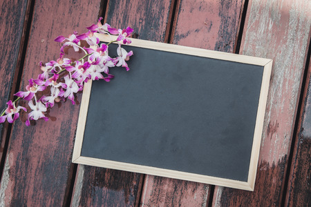 Chalkboard on old wooden floor background,vintage filterの写真素材