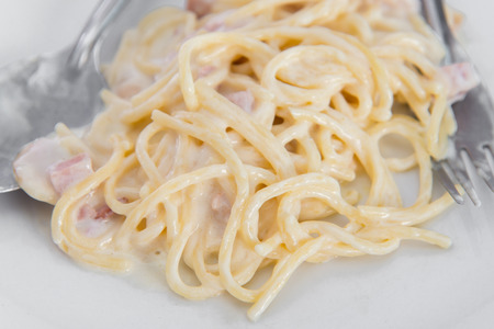 Close up of Spaghetti Carbonara with ham and cheeseの写真素材