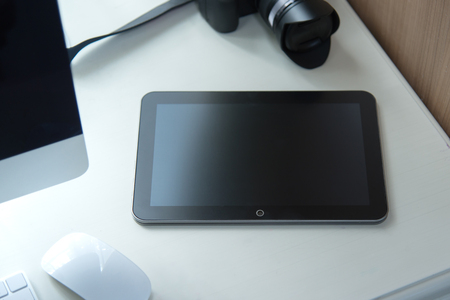 Close up of tablet on white tableの写真素材