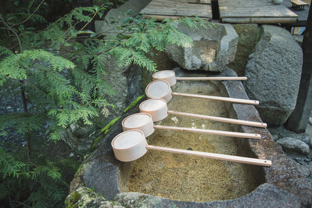 Close up of ladle on bamboo in japanese shrineの写真素材