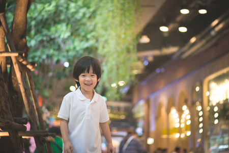 Cute  Asian child walking in the city,Shopping Streetの写真素材