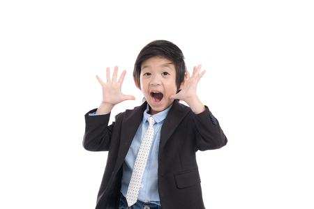 Asian child in business suit   is suprise and so happy about it on white background isolatedの写真素材