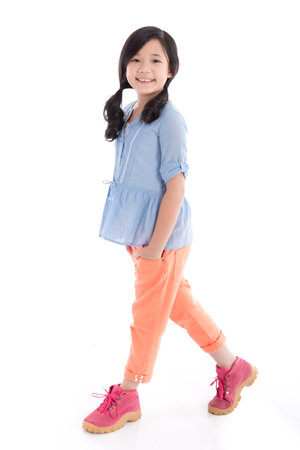 Beautiful asian girl standing on white background isolatedの写真素材