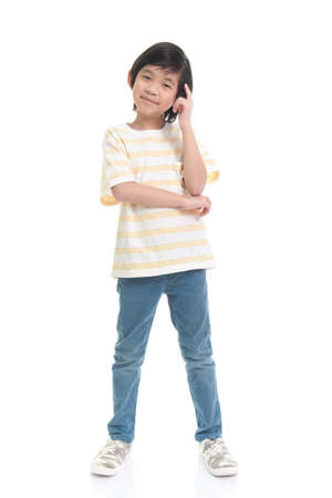 Cute Asian boy  thinking  on white background isolatedの写真素材