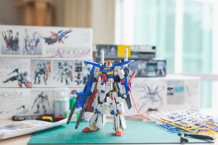 BANGKOK, THAILAND - March 22, 2021: Close up of Plastic model MSZ-010 ZZ GUNDAM VER KA  (MG)  scale 1:100 on wooden tableのeditorial素材