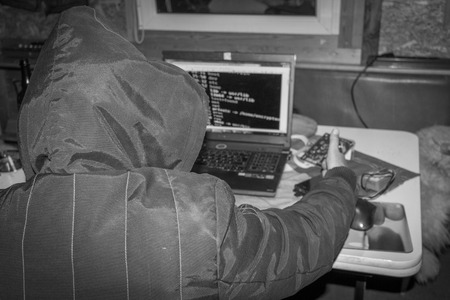 Cyber war, Hacker with laptop initiating hacker attack.の写真素材