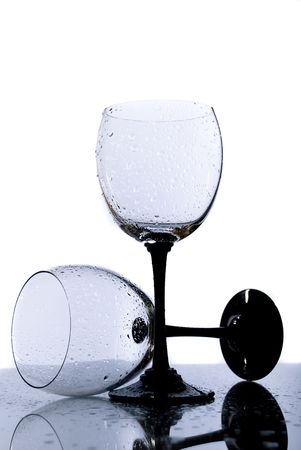 Two wine glass and water drops, isolated backgroundの写真素材