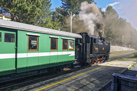 Vintage train awaits departure to train station 458