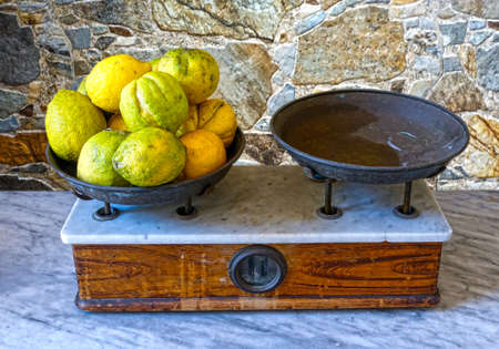 Lemons on the weighing panの写真素材