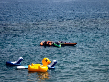 Rubber ducks in the sea, summer holidays in the Mediterraneanの写真素材