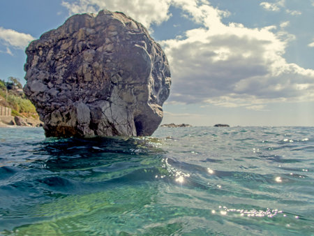 the rock in the middle of the sea in the warehouse of the priest Forza D'AgrÃ²の写真素材