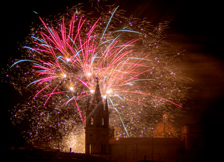 Colorful fireworks over the city of Acirealeの写真素材