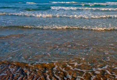 sand and wave on the beach as a background, closeup of photo