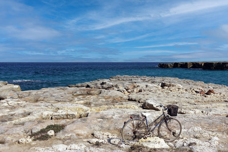 Cycling on the rocky coast of the Adriatic Sea in Salentoの写真素材