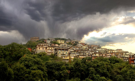 Rocca di Papa Under a Stormy and Dramatic Sky at Sunsetの写真素材
