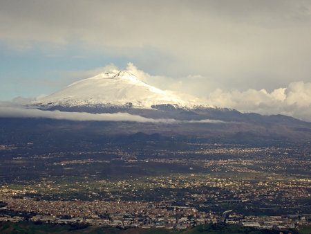 View from the top of a volcano, showing a city below.の写真素材