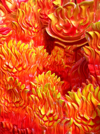 Close up of red and yellow candle in the form of a flower