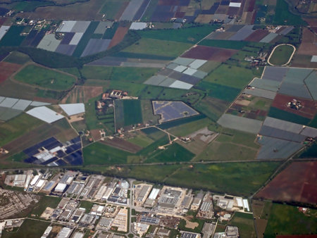 Aerial view of the industrial area and agricultural fields in Cisterna di Latina