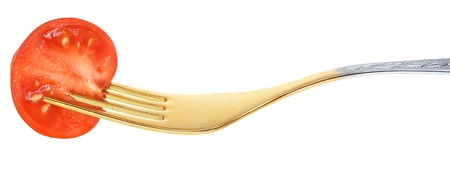 Tomato slice on a fork.の写真素材