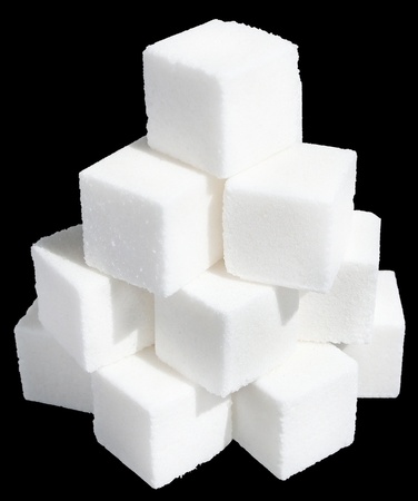 Pieces of sugar on a black background.の写真素材