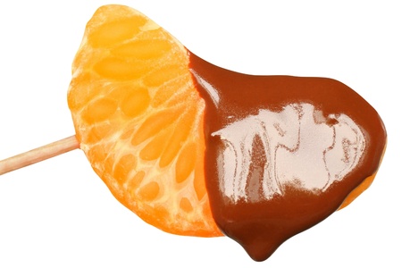 Chocolate covered tangerine close up on a white background.の写真素材