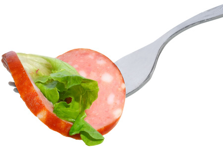 Fork with Sausage and salad on a white background.の写真素材